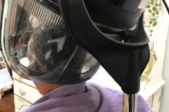 Seran Wrapped Hair Under Dryer for Deep Conditioning