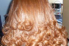 Thermally Straightened Silk Pressed Red Hair with Curls